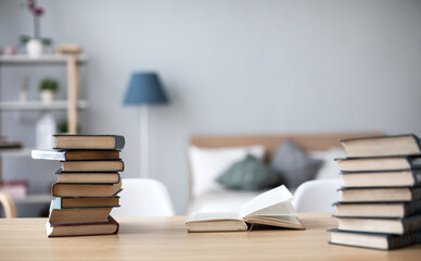 Learning at home, many books on the table.