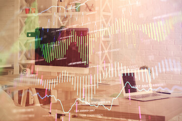 Double exposure of financial graph drawing and office interior background. Concept of stock market.