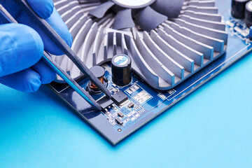 computer hardware support service concept. technician diagnosing and repairing pcb circuit board