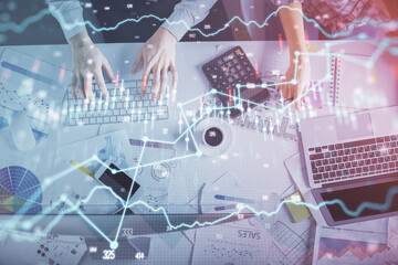 Double exposure of man and woman working together and financial chart hologram drawing. market analysis concept. Computer background. Top View.