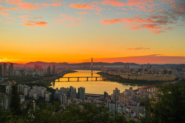 View city scapse morning in  seoul City south korea. skyscraper  and financial office beautiful construction witn han river seen from maebong mountain at summer in south korea