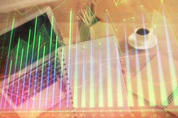 Double exposure of businesswoman hands typing on computer and forex chart hologram drawing....