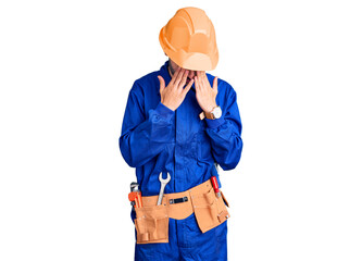 Young hispanic man wearing worker uniform rubbing eyes for fatigue and headache, sleepy and tired...