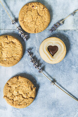 Some cookies on a marble table with lavender, background