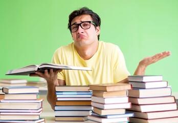 Student with too many books to read before exam