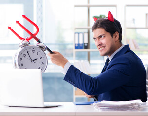 Devil angry businessman in the office