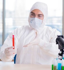 Man doctor checking blood samples in lab