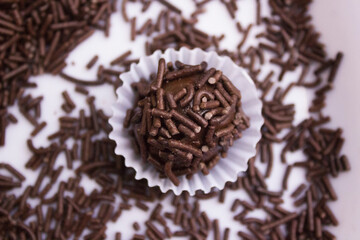 Chocolate granulated is poured. Homemade brazilian sweets. Brigadeiro, Portuguese for 