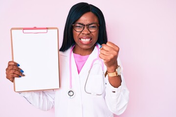 Young african american woman wearing doctor stethoscope holding clipboard annoyed and frustrated shouting with anger, yelling crazy with anger and hand raised