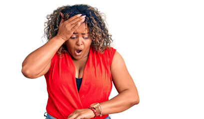 Young african american plus size woman wearing casual style with sleeveless shirt looking at the...