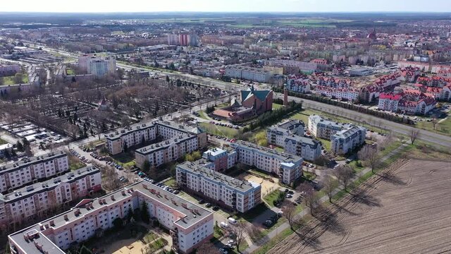 Aerial view of modern residential areas of Polish city of Leszno in sunny spring day. High quality 4k footage