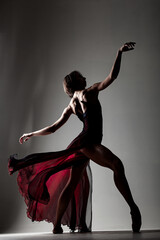 ballerina with a waving red dress