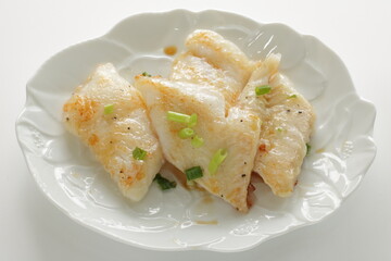 Homemade flat fish fillet served with spring onion