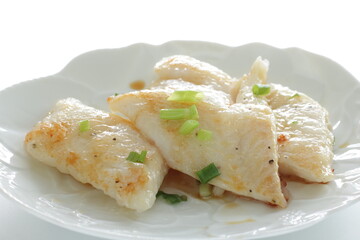 Homemade flat fish fillet served with spring onion