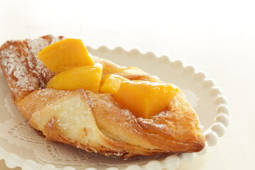Homemade mango pastry on dish with copy space