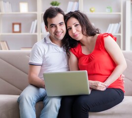 Fototapeta premium Young couple family expecting a baby