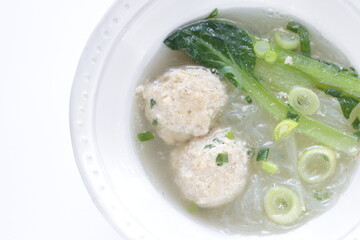 Chinese food, meat ball and glass noodles in green leaves vegetable  soup