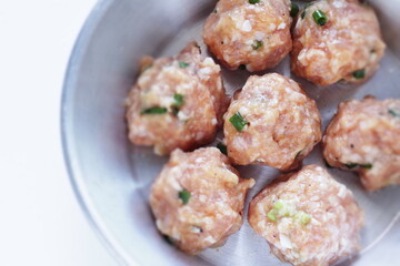 Homemade scallion and green onion meat ball on pan for Chinese cooking