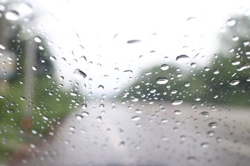 water drop or raindrop on glass of car
