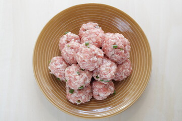 homemade Chinese pork meat ball on brown dish