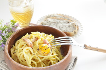 Italian food, carbonara spaghetti in wooden bowl