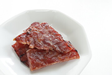 Taiwanese food, spicy beef jerky on dish with copy space