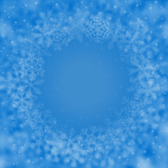 Christmas background of snowflakes of different shape, blur and transparency, arranged in a circle, on light blue background