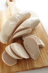 Fototapeta na wymiar sliced sausage on wooden chopping board