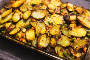 plant-based food, vegan potato bake with garden vegetables and nutritional yeast sauce