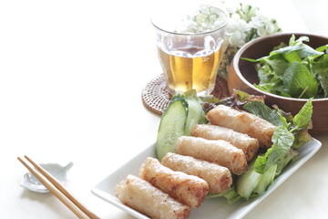 Vietnamese food, deep fried spring roll served with cucumber and salad