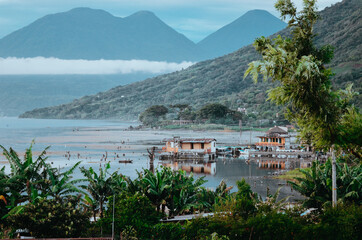 Nice view of houses at shore of a lake in the mountains