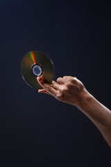 hand holding cd