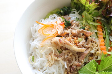 Vietnamese food, grilled pork and rice noodle herbal salad