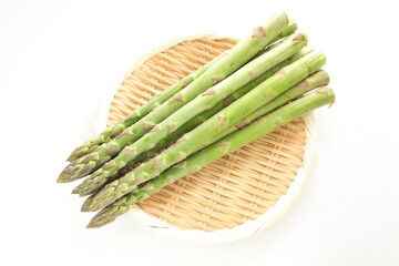 Japanese Green asparagus on bamboo basket for cooking ingredient 