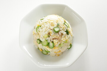 green asparagus and chicken fried rice on white dish