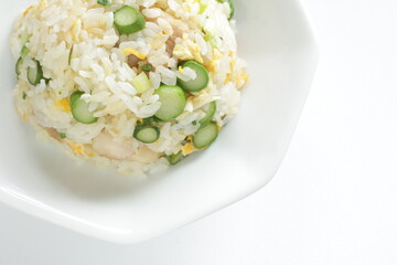 green asparagus and chicken fried rice on white dish