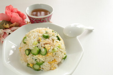 green asparagus and chicken fried rice on white dish