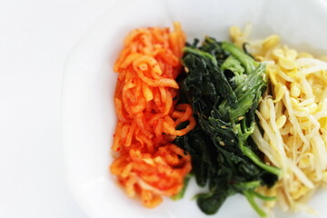 Korean food, homemade Namul seasoning radish and spinach with soy sprout