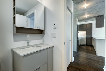 Real estate photography - Beautiful empty brand new apartment in an apartment building with bathroom, new kitchen, new floors, all white painted