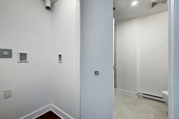Real estate photography - Beautiful empty brand new apartment in an apartment building with bathroom, new kitchen, new floors, all white painted