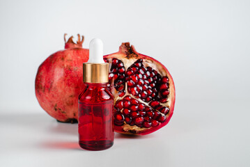 Essence for facial health with  pomegranate extract. Antiage cosmetics for skin lifting. Serum in...