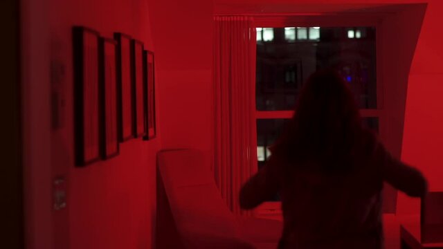 Woman walking to the window