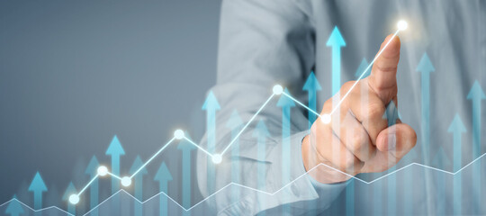 Businessman plan graph growth and increase of chart positive indicators in his business