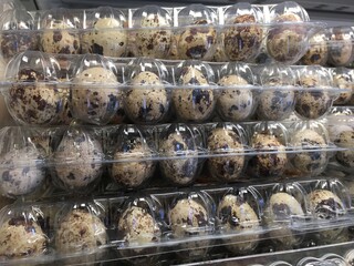 eggs on the counter in the store in stacks. Chicken or quail eggs buy in the store