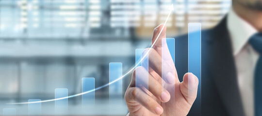 Businessman plan graph growth and increase of chart positive indicators in his business