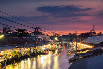 Floating market food at night in the river at Amphawa, Samut Songkhram Province, Thailand. The culture travel local boat in canal water. The Asia tourism concept
