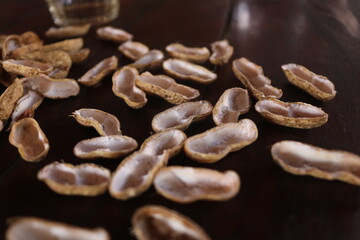 Obraz premium The peanut, also known as the groundnut, goober (US), or monkey nut (UK), and taxonomically classified as Arachis hypogaea, is a legume crop grown mainly for its edible seeds.