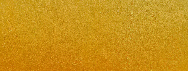 Gold texture background. Concrete wall texture paint, gold color surface blank for design