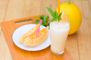 Orange Milk melon Smoothie in glass for drink