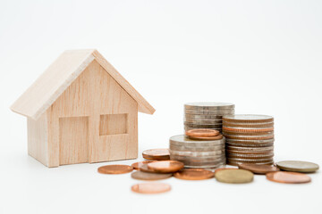 Model house, coins stack on white background  for money saving concept